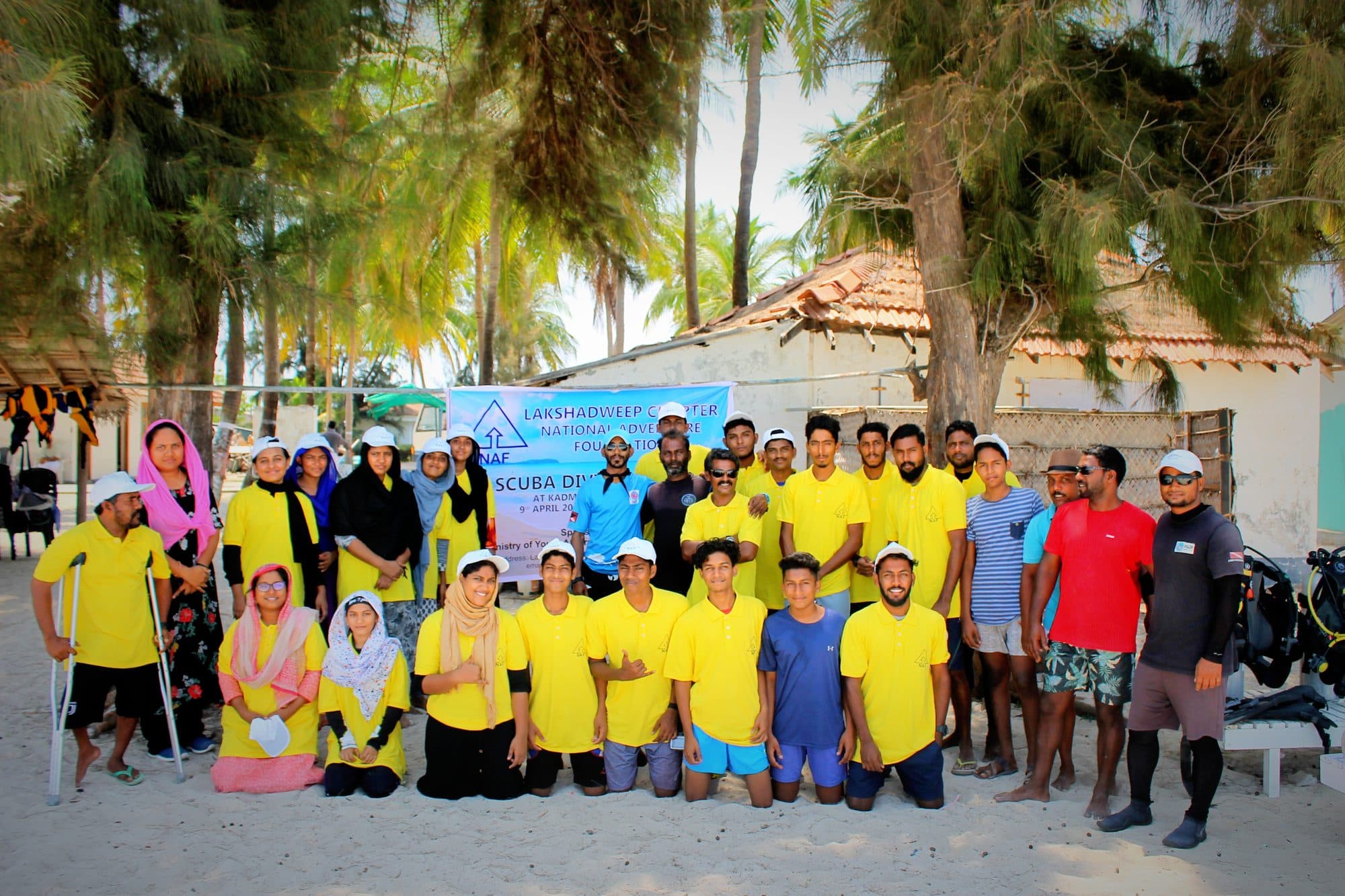 Participants of an NAF Lakshadweep scuba camp gathered on the shore before a dive
