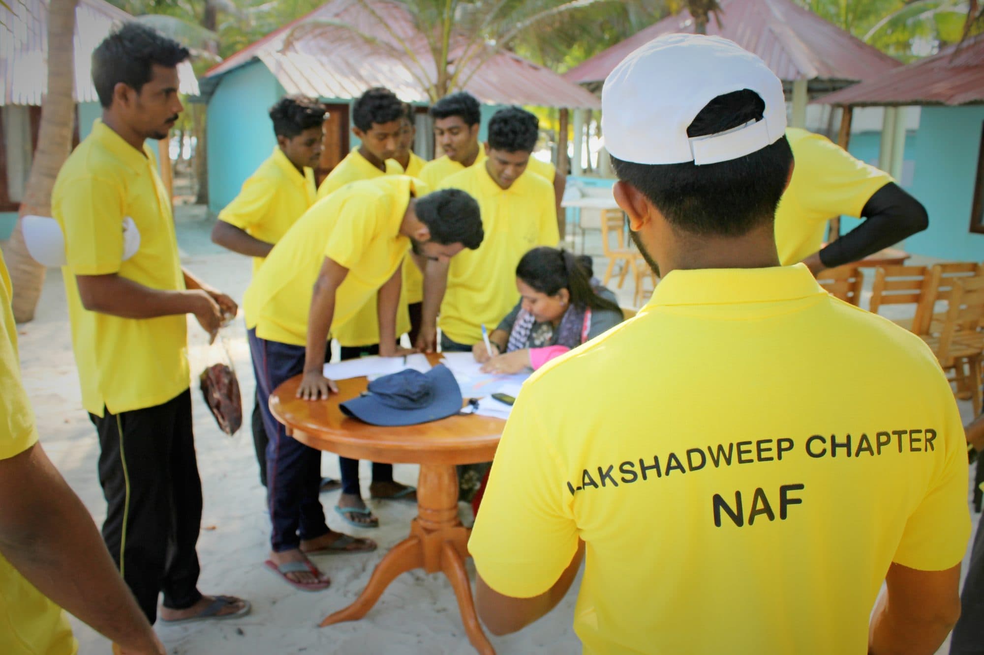 Instructors registering and briefing trainees at the camp desk